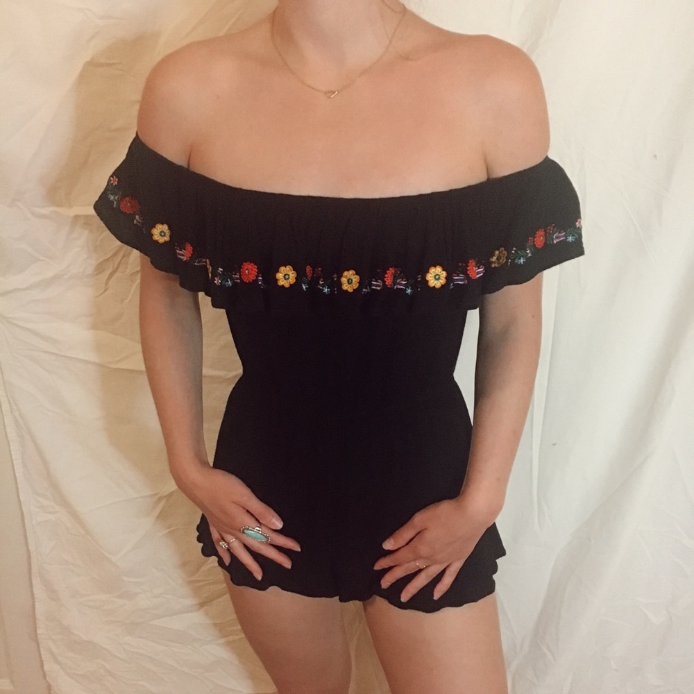 Black romper with floral details